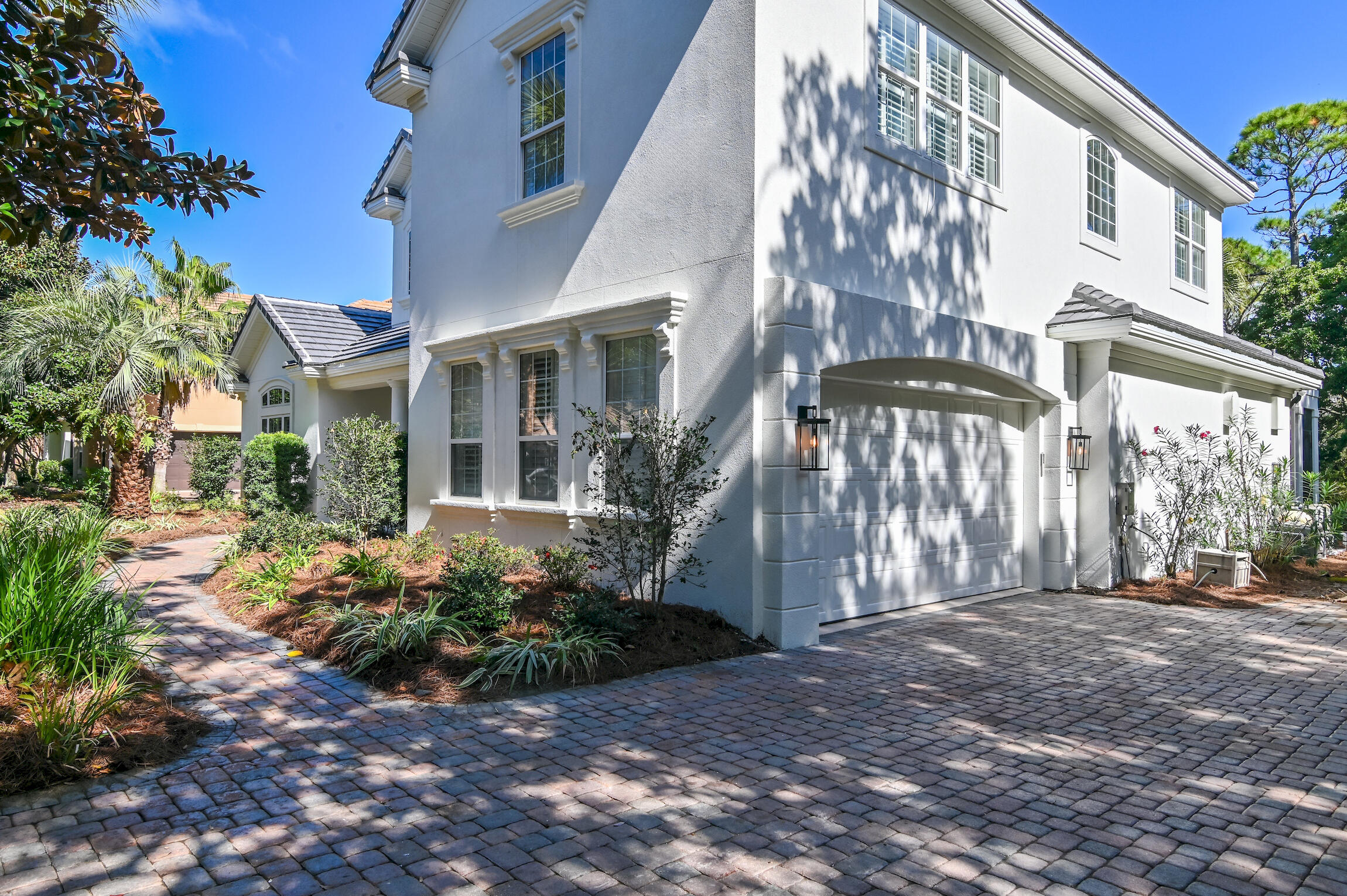 488 Regatta Bay Boulevard Destin, FL 32541 - Photo 41 of 46 a front view of a building with a garden