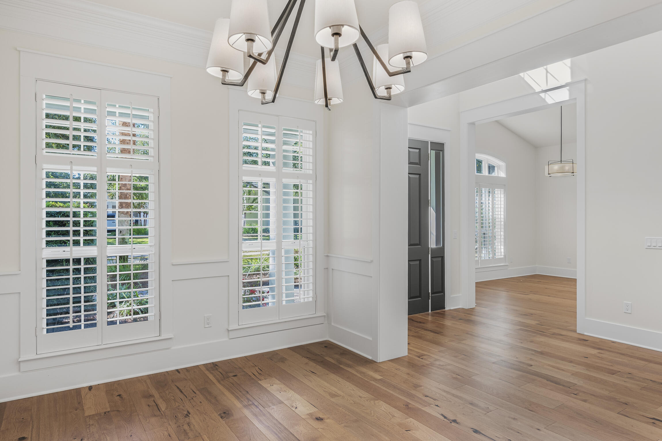 488 Regatta Bay Boulevard Destin, FL 32541 - Photo 6 of 46 a view of an empty room with wooden floor and a window