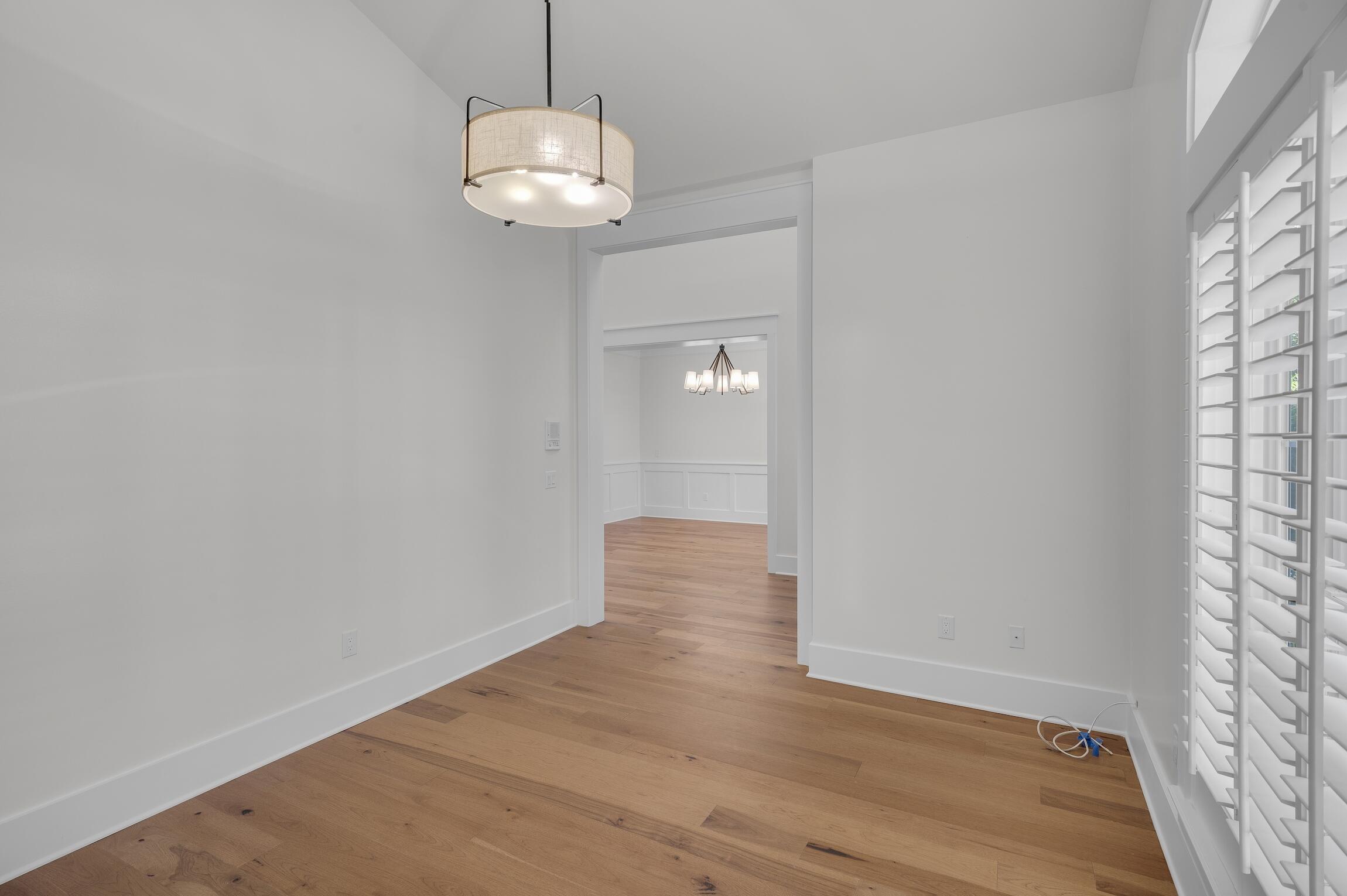 488 Regatta Bay Boulevard Destin, FL 32541 - Photo 8 of 46 wooden floor in an empty room with a window