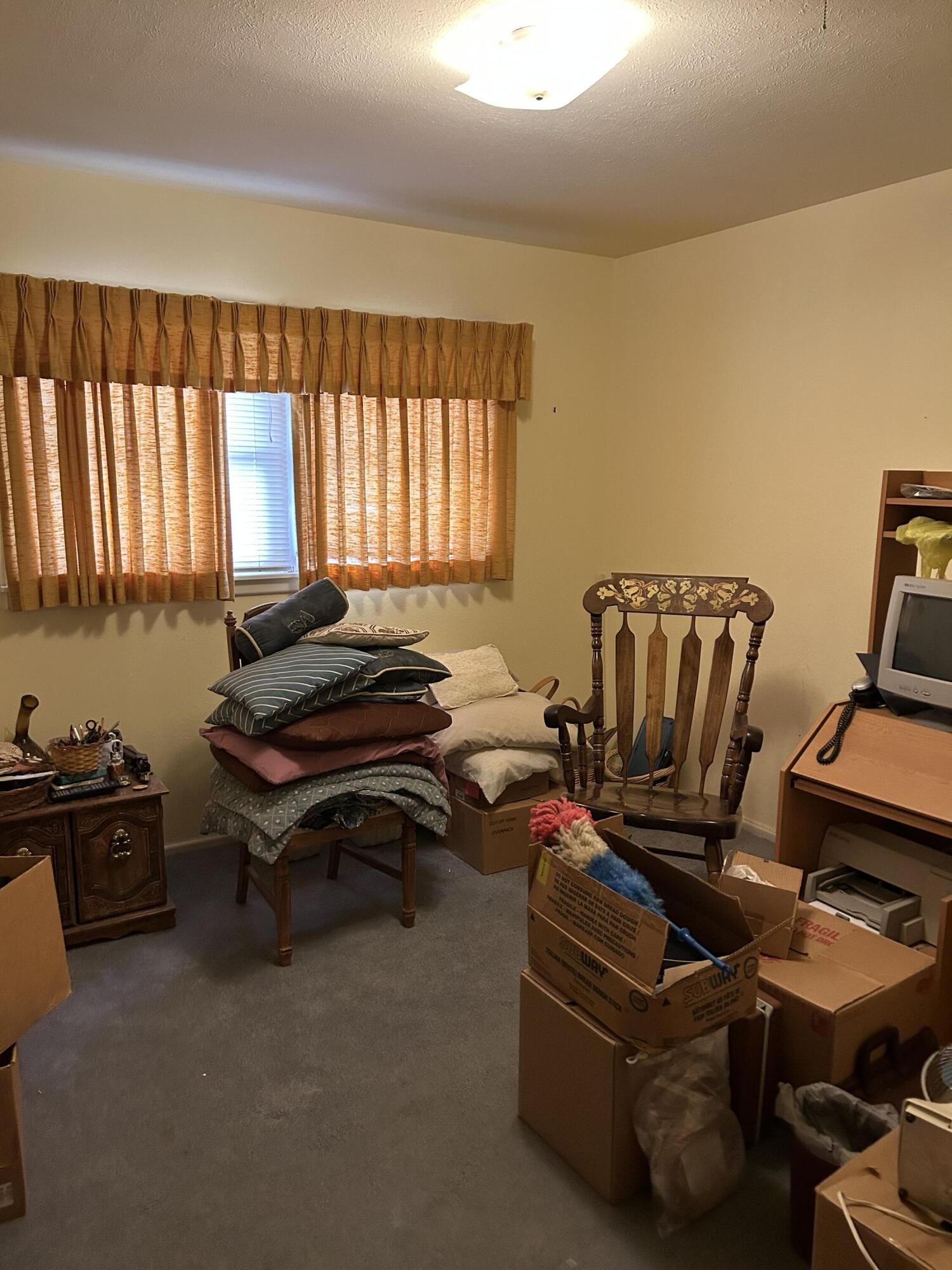 2802 Walnut Avenue Lubbock, TX 79404 - Photo 7 of 13 a living room with furniture a air conditioner and a window