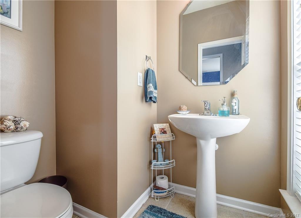 225 Mott Road Mooresville, NC 28115 - Photo 18 of 24 a bathroom with a sink toilet and a mirror