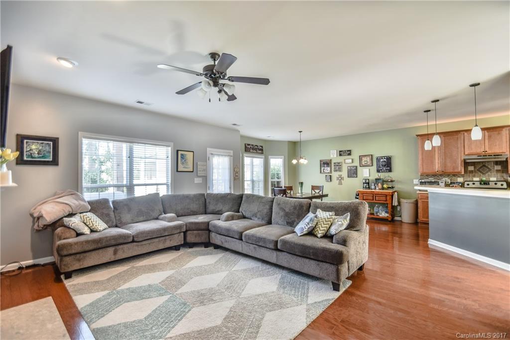 225 Mott Road Mooresville, NC 28115 - Photo 8 of 24 a living room with furniture and a large window
