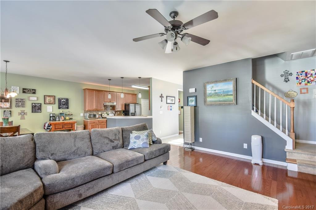 225 Mott Road Mooresville, NC 28115 - Photo 9 of 24 a living room with furniture and a wooden floor