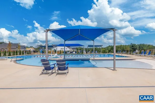 a view of a swimming pool with a patio
