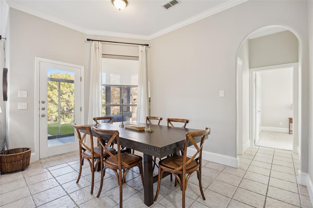 3611 Skinner Road Midlothian, TX 76065 - Photo 12 of 40 a view of a dining room with furniture and window