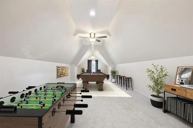 a living room with furniture and flowers