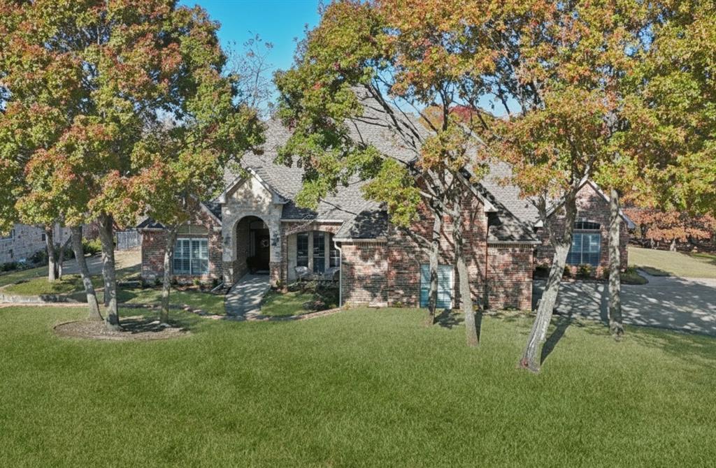 3611 Skinner Road Midlothian, TX 76065 - Photo 3 of 40 a front view of a house with garden