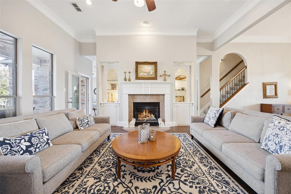 3611 Skinner Road Midlothian, TX 76065 - Photo 6 of 40 a living room with furniture a window and a fireplace