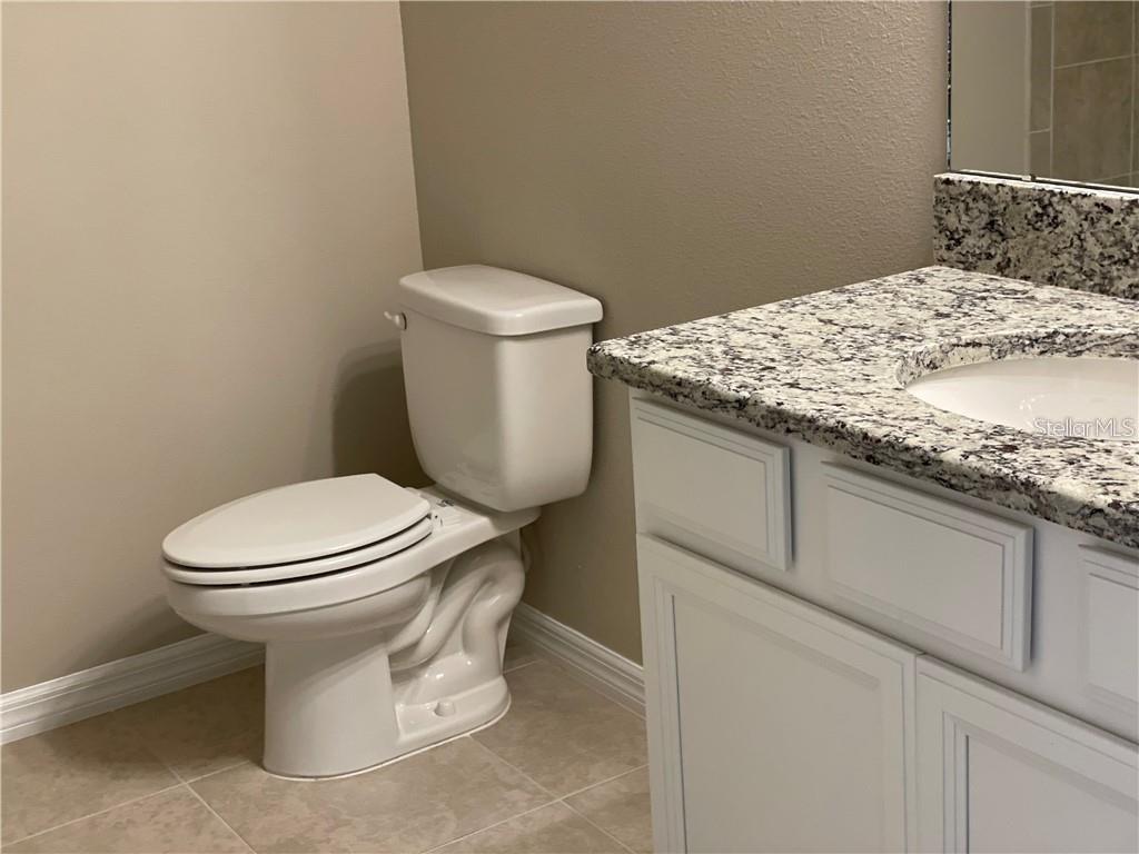 13823 Messina Loop, Unit 203 Bradenton, FL 34211 - Photo 14 of 15 a bathroom with a toilet and a sink