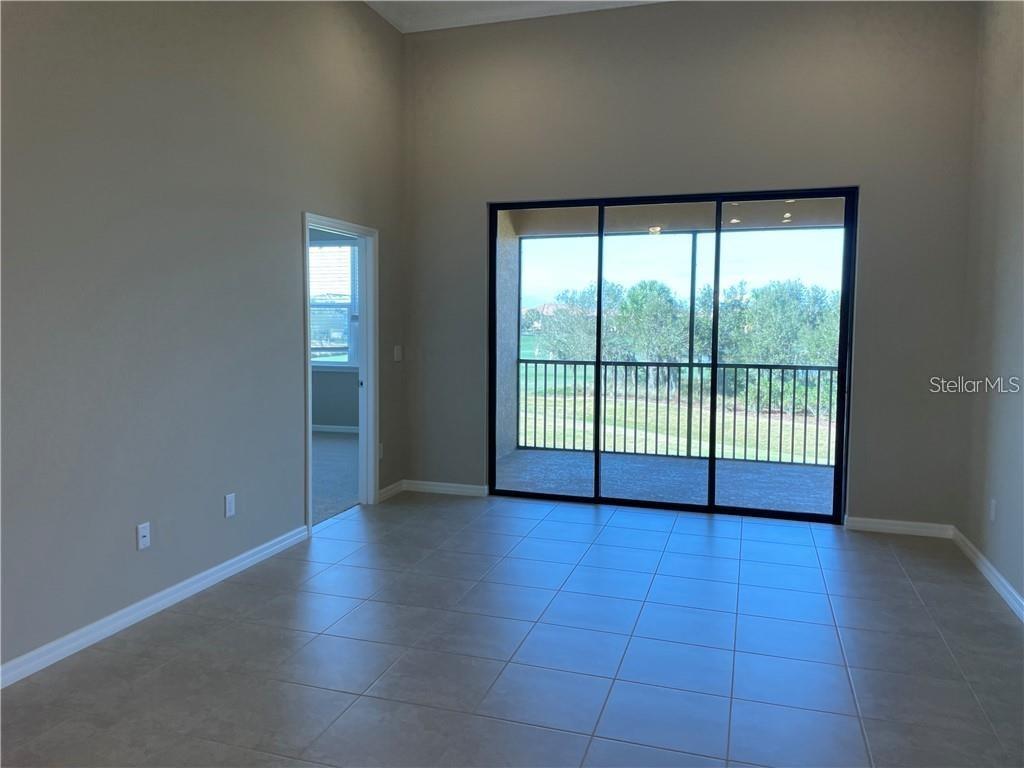 13823 Messina Loop, Unit 203 Bradenton, FL 34211 - Photo 2 of 15 a view of an empty room with a window