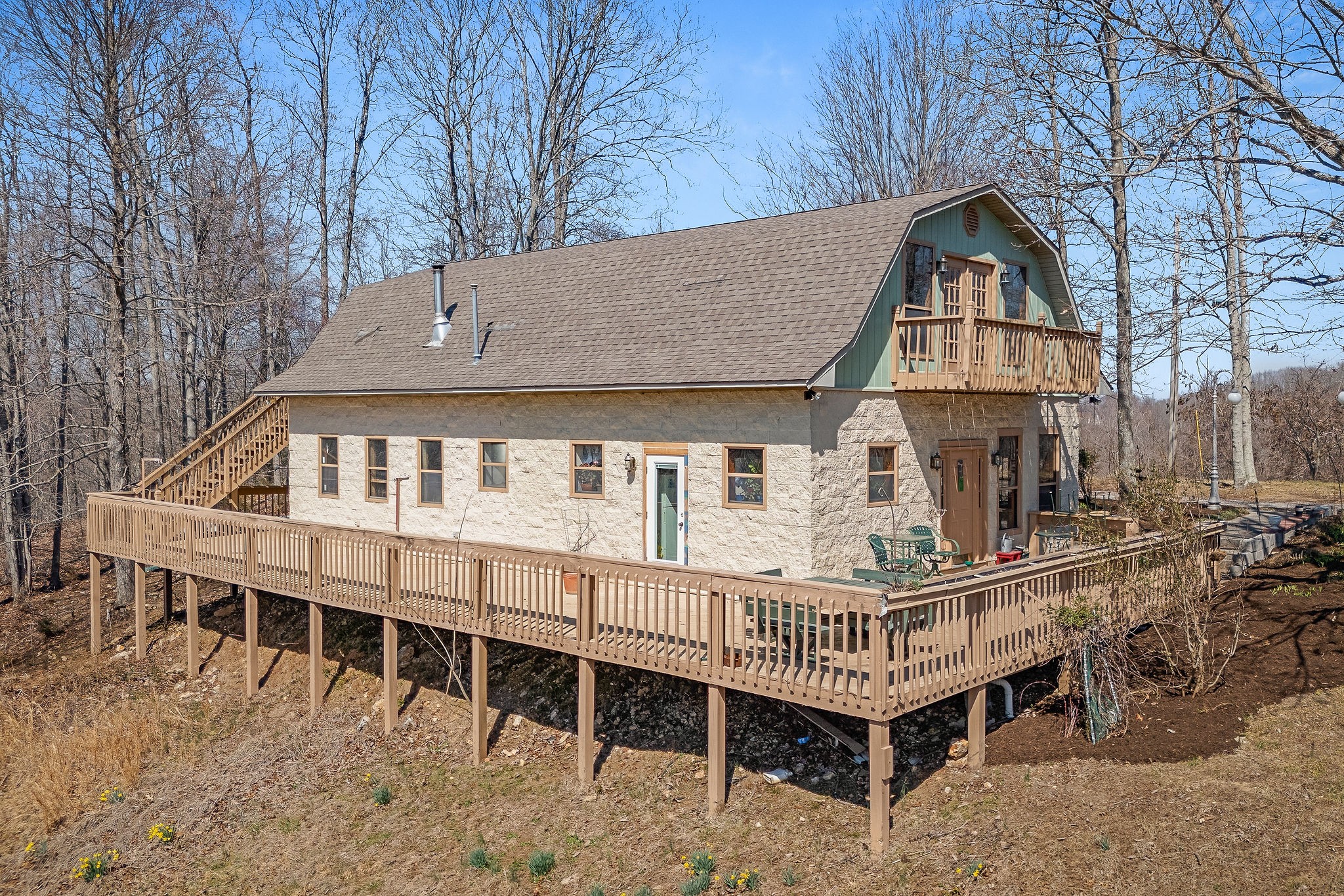 a front view of a house with a deck