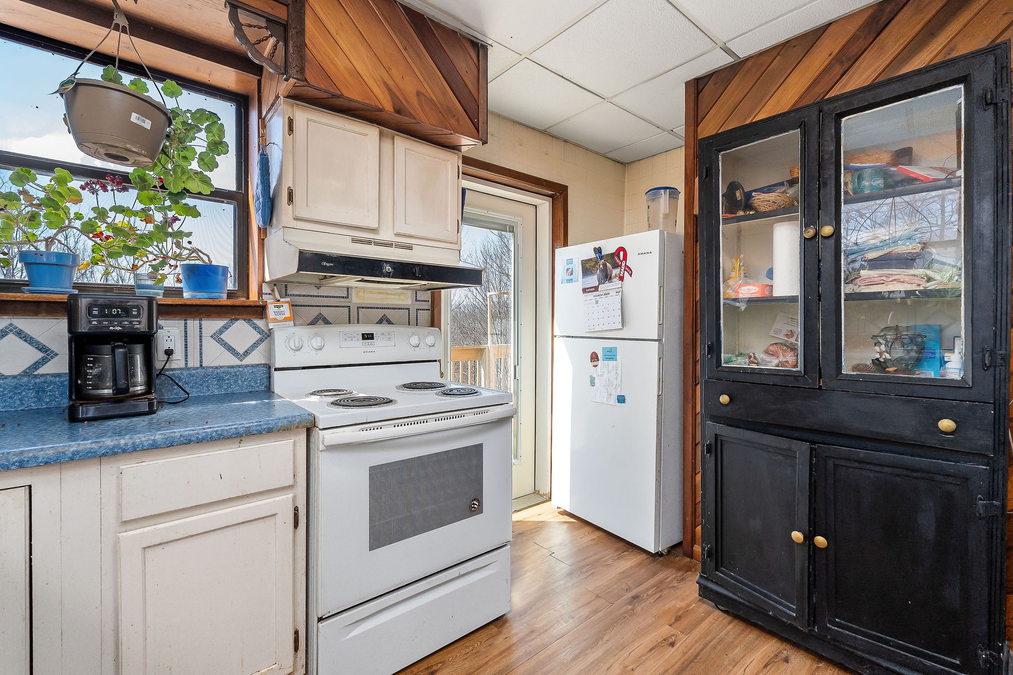 5980 Ashburn Road Baxter, TN 38544 - Photo 18 of 65 a kitchen with stainless steel appliances granite countertop a refrigerator a stove and a wooden floors