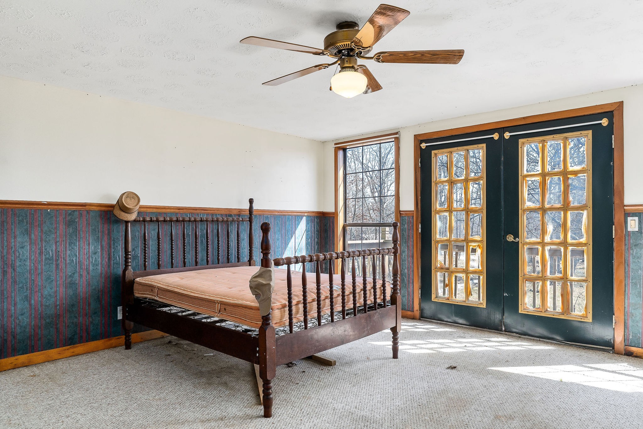 5980 Ashburn Road Baxter, TN 38544 - Photo 23 of 65 a bedroom with a bed and a chandelier