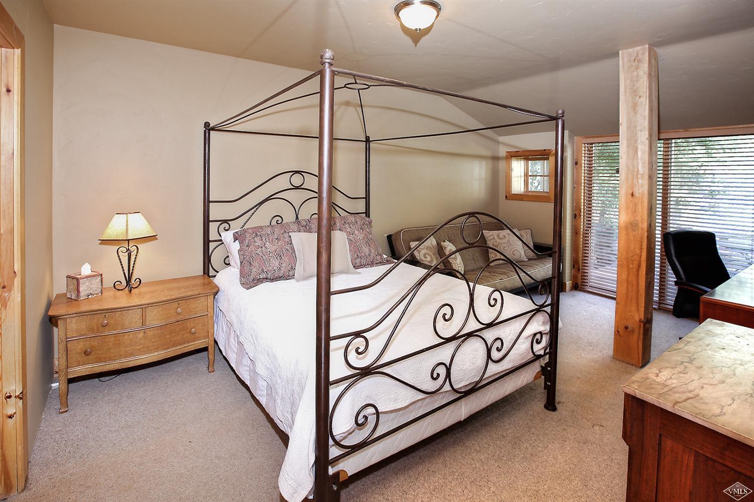 440 Eagle River Street Minturn, CO 81645 - Photo 20 of 24 a bedroom with bed and a mirror