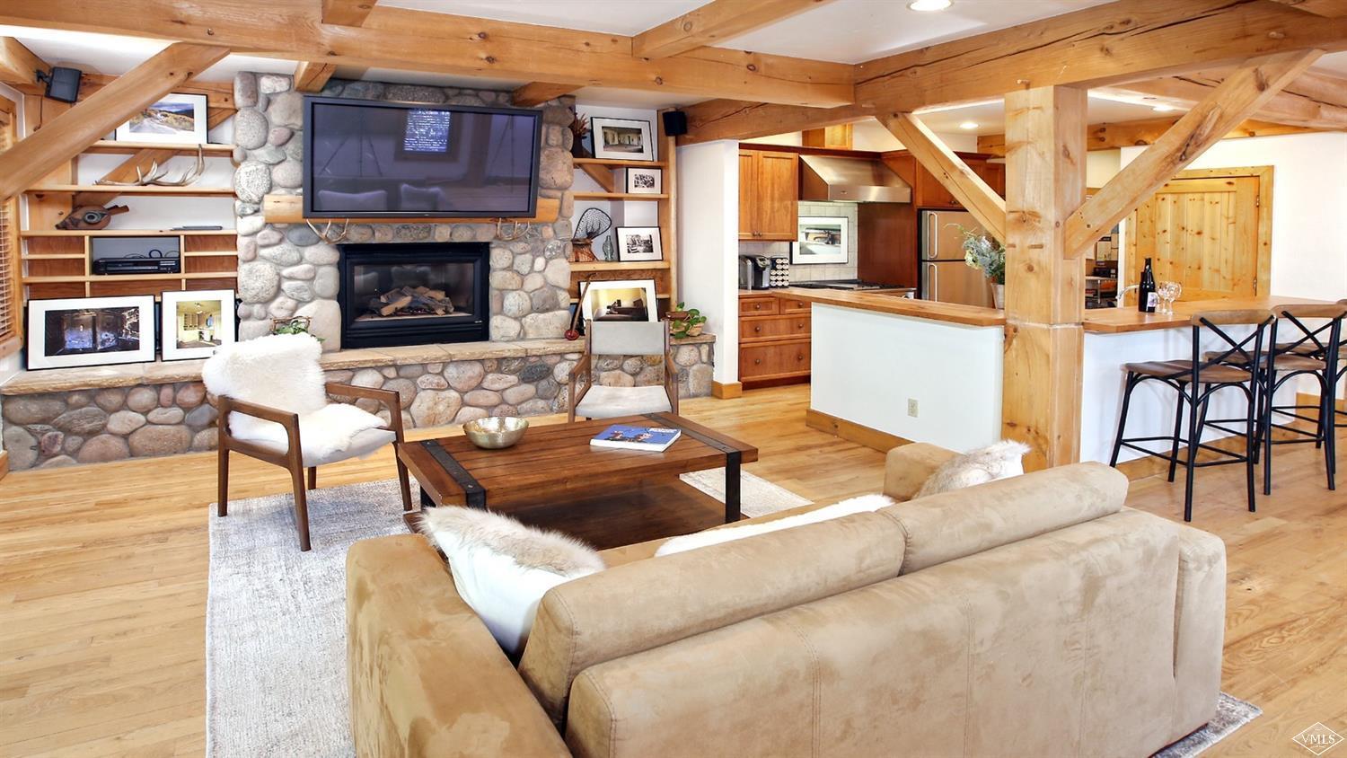 440 Eagle River Street Minturn, CO 81645 - Photo 5 of 24 a living room with fireplace furniture and a fireplace