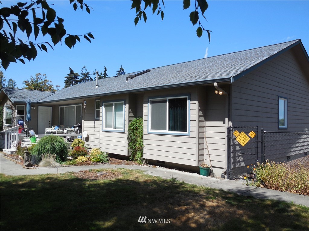 190 Booth Lane Sequim, WA 98382 - Photo 3 of 32 a front view of a house with garden
