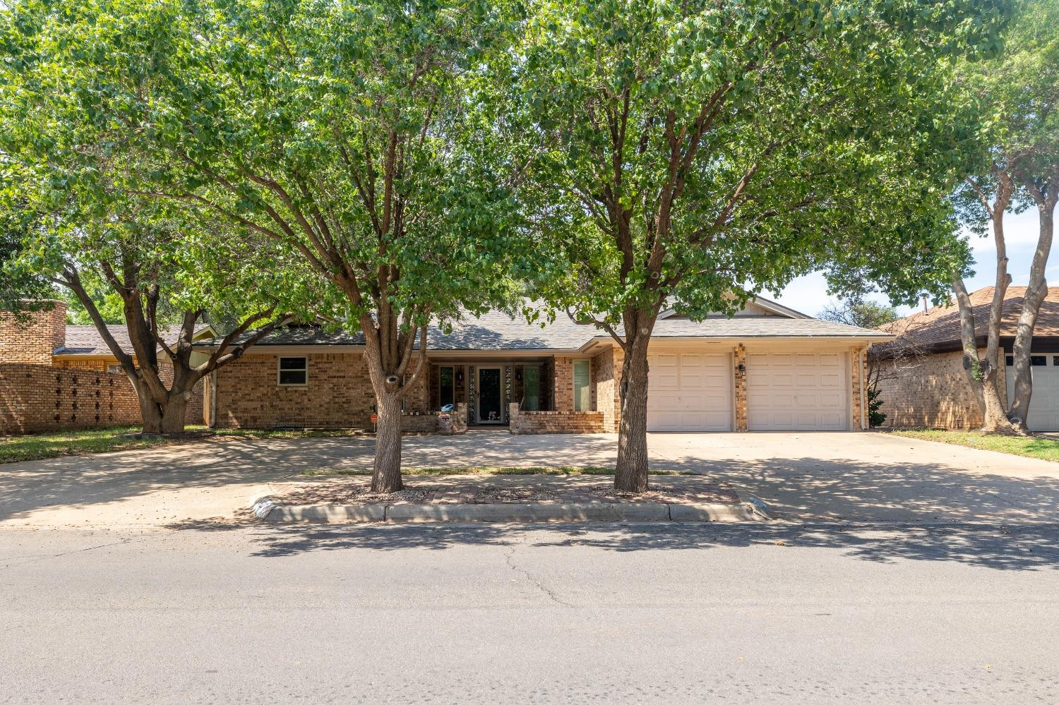 4522 79th Street Lubbock, TX 79424 - Photo 14 of 14 a house with tree in front of it