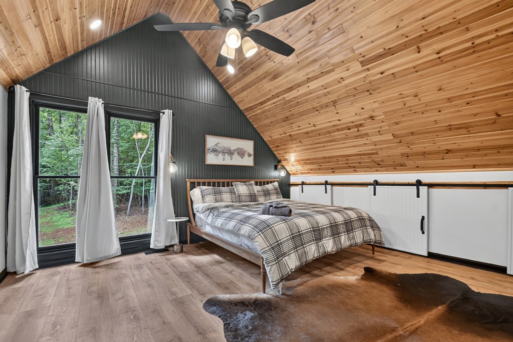 2 Watson Gap Road Mineral Bluff, GA 30559 - Photo 36 of 62 a spacious bedroom with a bed and a large window