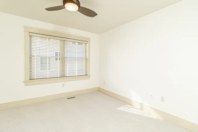 a bathroom with a granite countertop toilet a sink and a bathtub