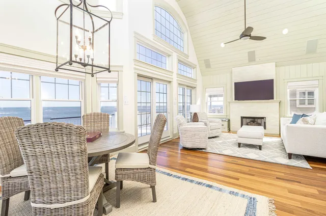 an open kitchen with dining table and chairs