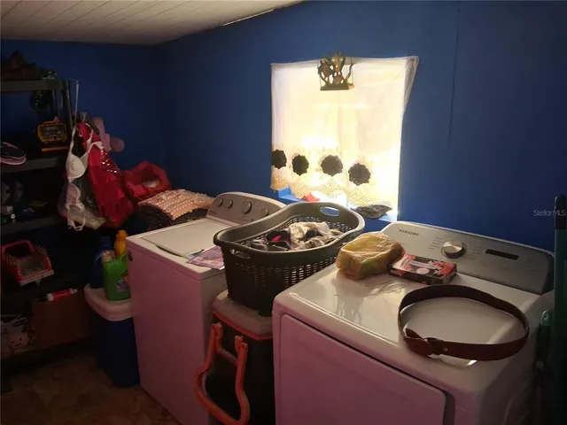 a room with a stove and a wooden closet