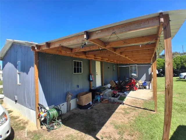 a view of a couches in patio and a yard