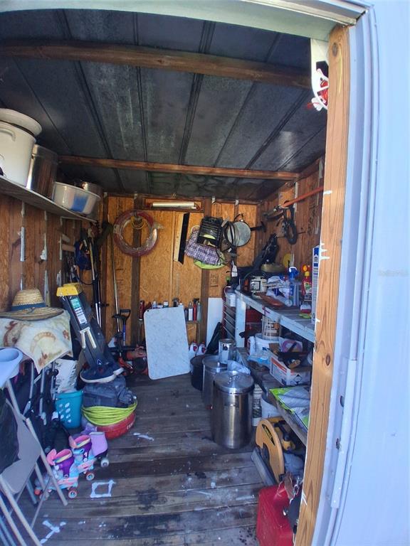 6290 Southeast 140th Place Summerfield, FL 34491 - Photo 31 of 32 a room with lots of wooden furniture