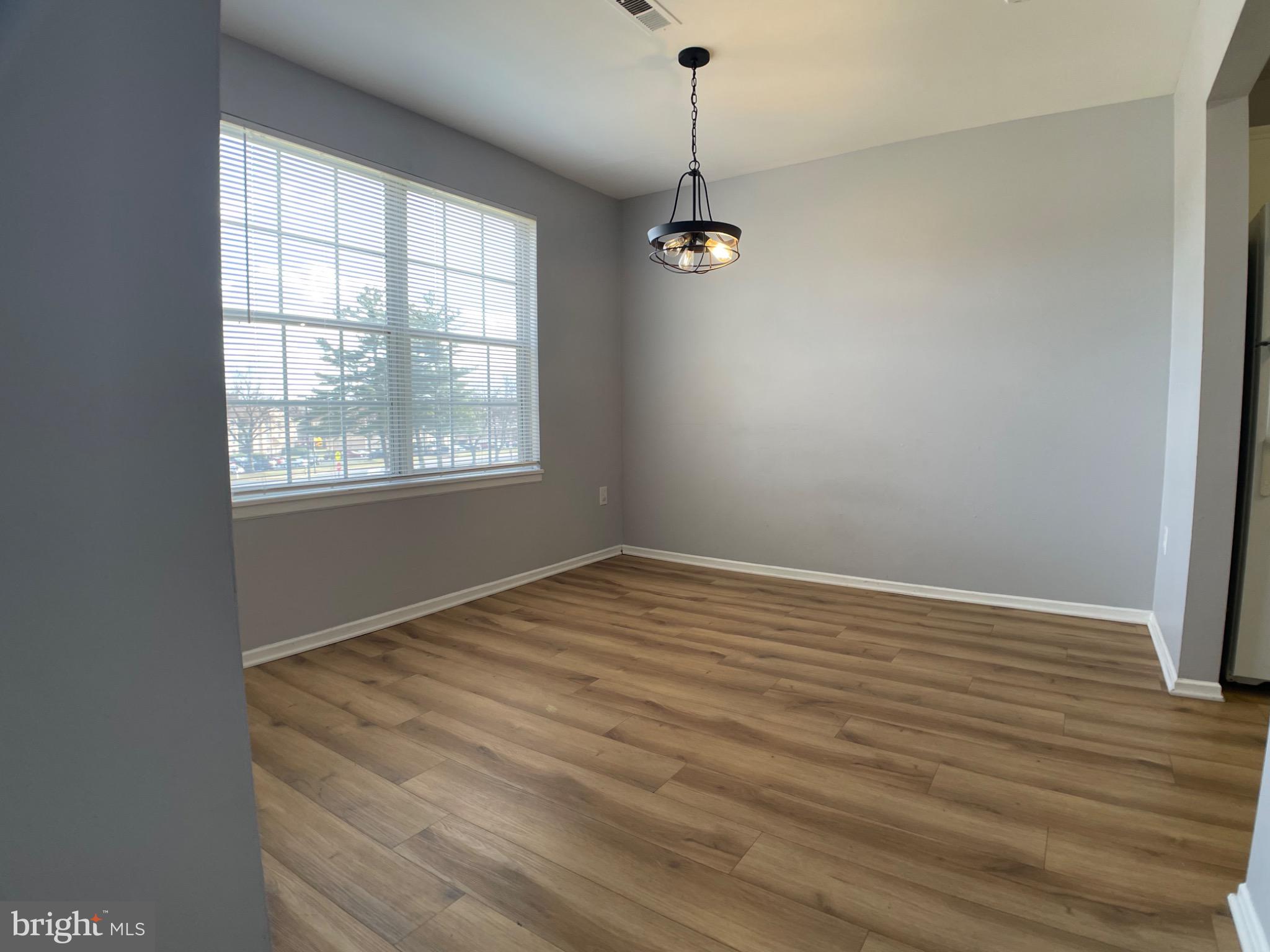 1401 Key Parkway, Unit 204 Frederick, MD 21702 - Photo 25 of 27 Large dining area with upgraded fixture