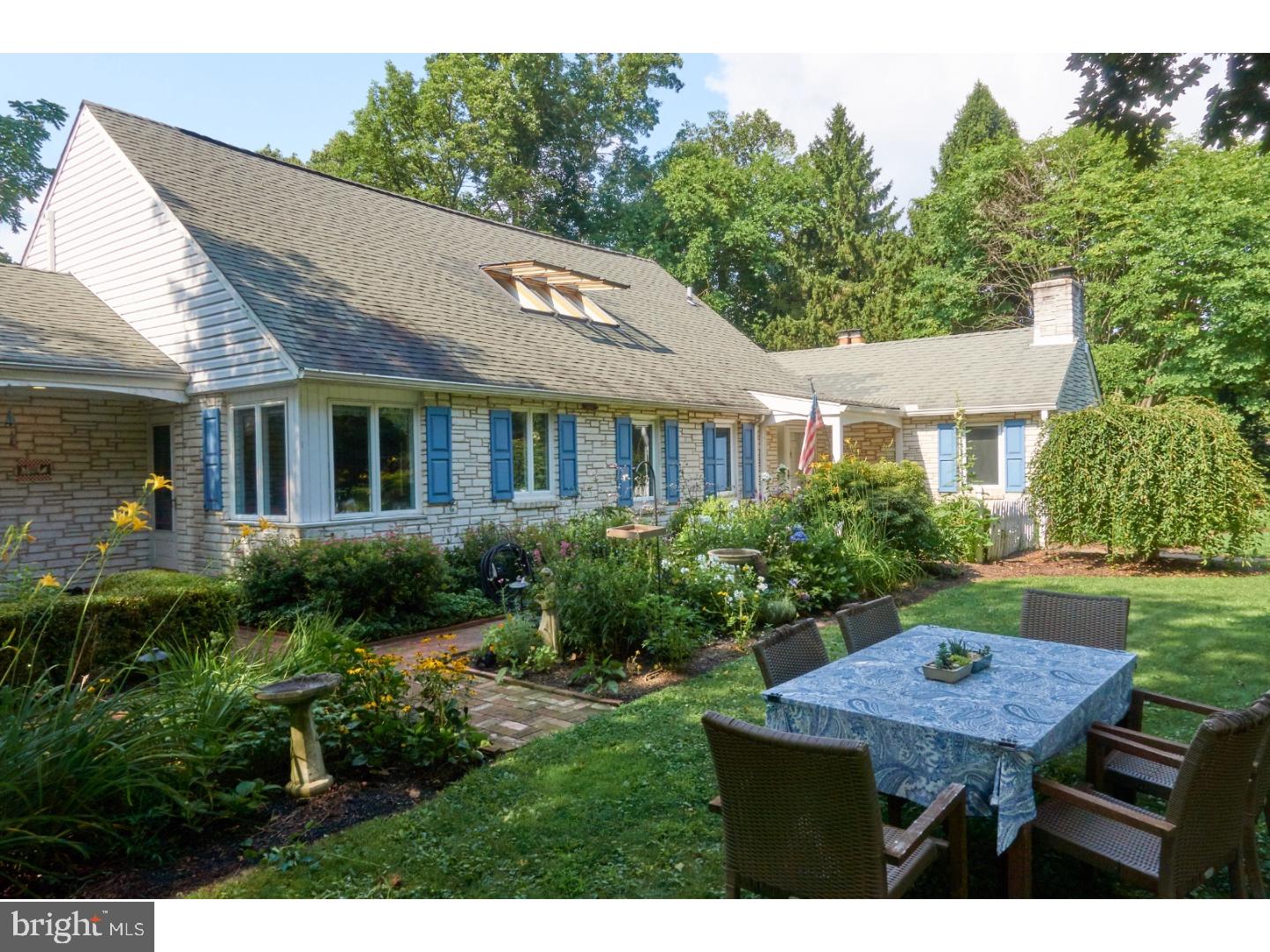 720 Panorama Road Villanova, PA 19085 - Photo 18 of 19 a backyard of a house with garden table and chairs