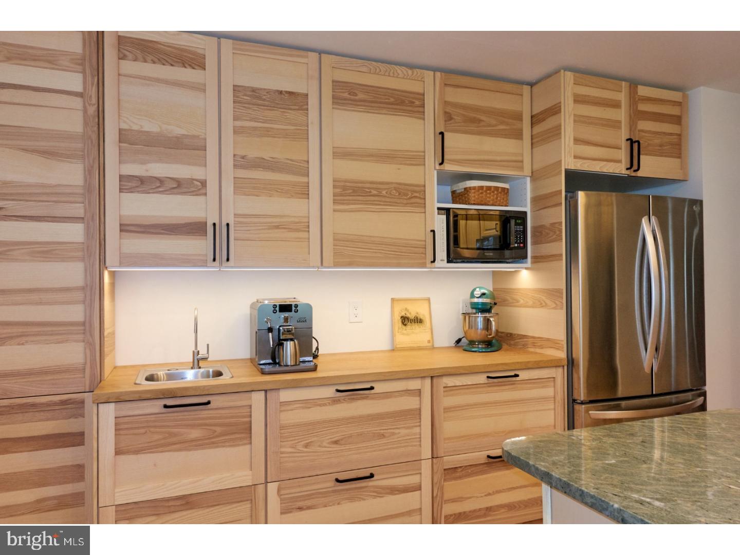 720 Panorama Road Villanova, PA 19085 - Photo 3 of 19 a kitchen with stainless steel appliances kitchen island granite countertop a refrigerator and cabinets
