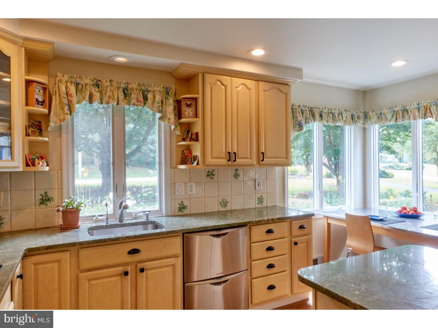 720 Panorama Road Villanova, PA 19085 - Photo 4 of 19 a kitchen with stainless steel appliances granite countertop a stove a sink and a granite counter tops with large windows