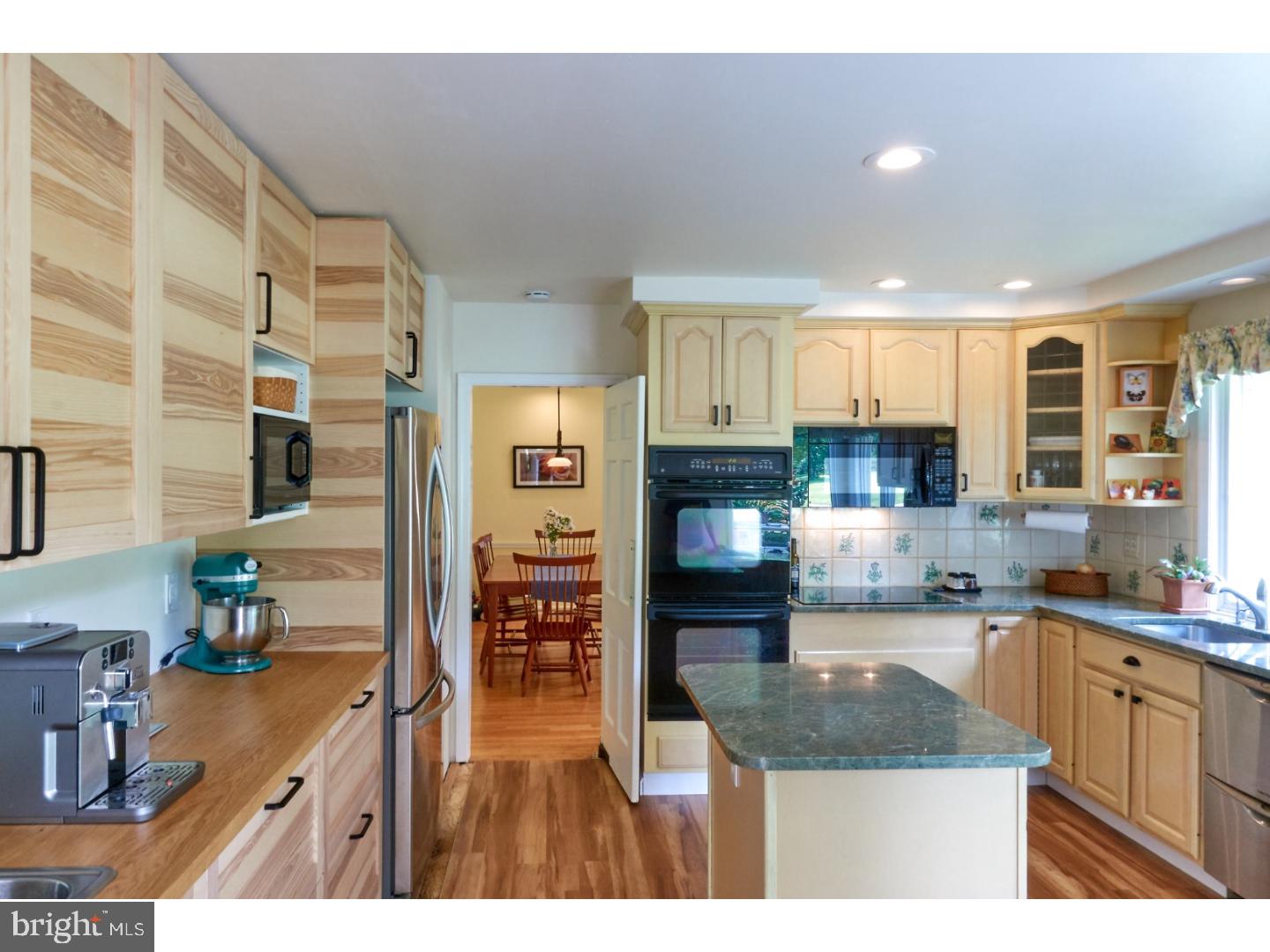 720 Panorama Road Villanova, PA 19085 - Photo 5 of 19 a kitchen with kitchen island granite countertop a sink cabinets and stainless steel appliances