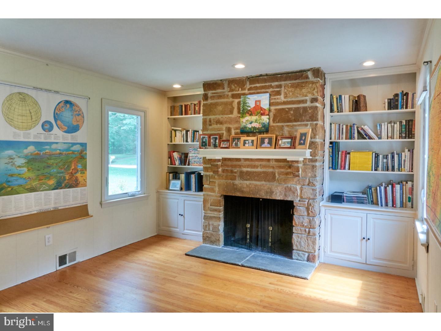 720 Panorama Road Villanova, PA 19085 - Photo 7 of 19 a living room with stainless steel appliances furniture a fireplace and a window