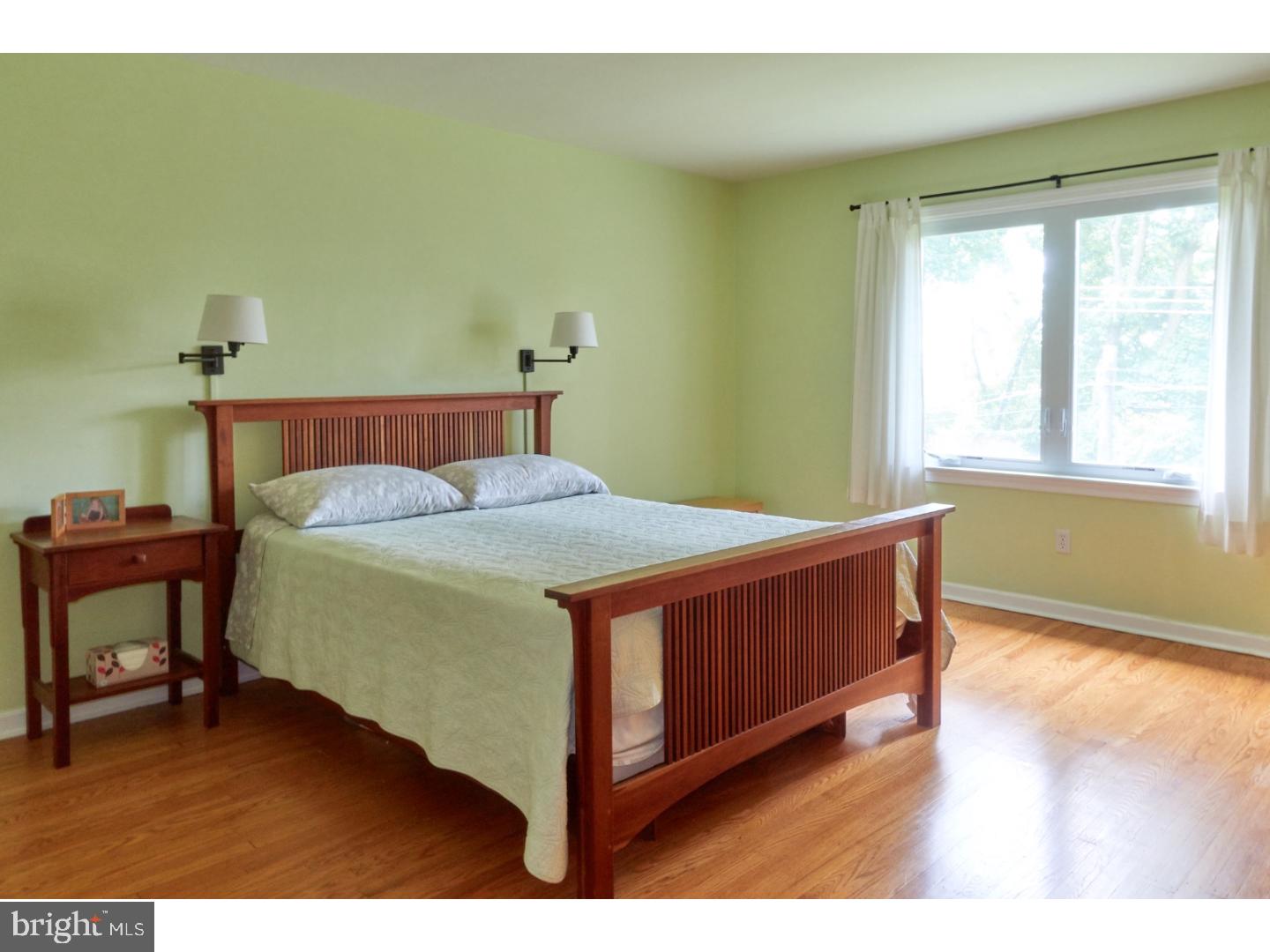 720 Panorama Road Villanova, PA 19085 - Photo 10 of 19 a bed sitting in a bedroom next to a window