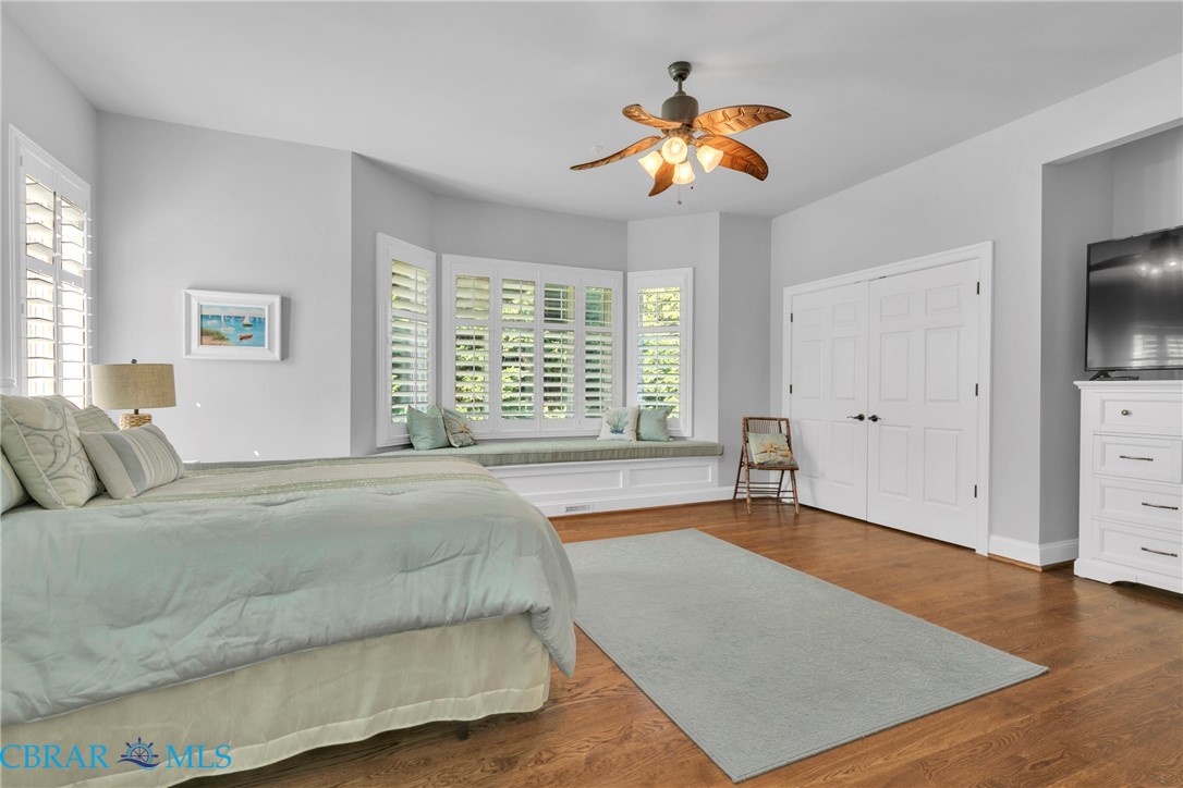 2106 Clarketown Road Heathsville, VA 22473 - Photo 25 of 56 a bedroom with a bed and a chandelier