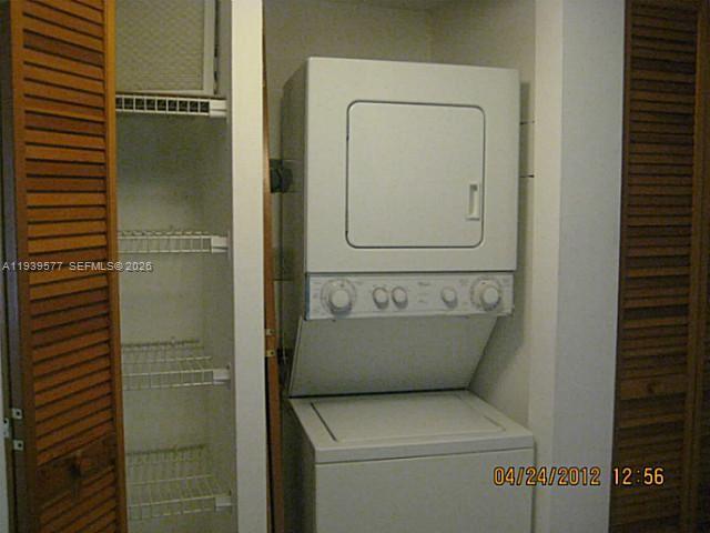 9015 Southwest 125th Avenue, Unit N406 Miami, FL 33186 - Photo 13 of 24 a utility room with a washer and dryer