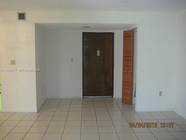9015 Southwest 125th Avenue, Unit N406 Miami, FL 33186 - Photo 16 of 24 an empty room with closet