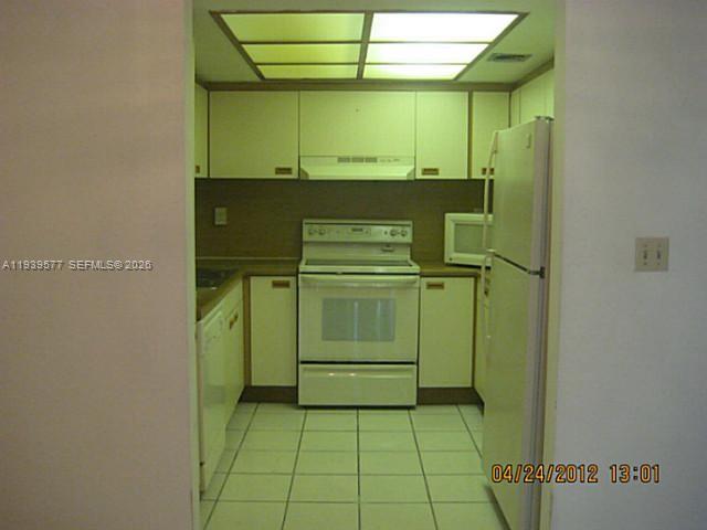 9015 Southwest 125th Avenue, Unit N406 Miami, FL 33186 - Photo 19 of 24 a view of a utility room with washer and dryer