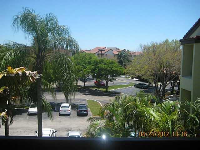 9015 Southwest 125th Avenue, Unit N406 Miami, FL 33186 - Photo 20 of 24 a view of swimming pool with seating space