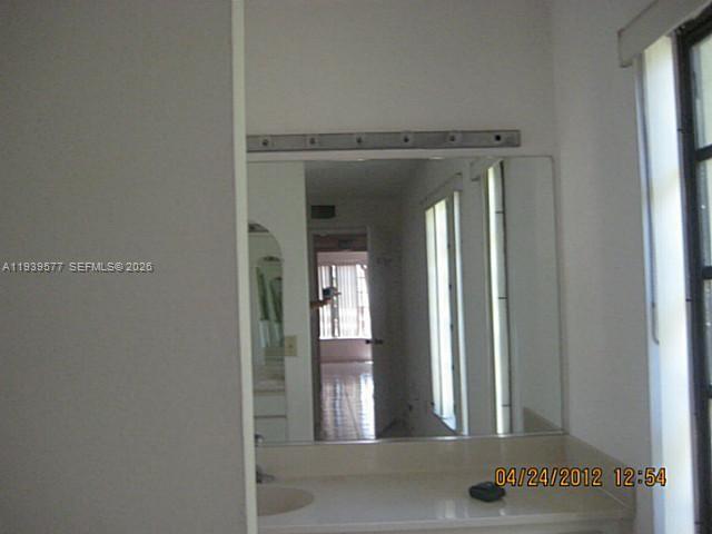 9015 Southwest 125th Avenue, Unit N406 Miami, FL 33186 - Photo 7 of 24 a view of a hallway