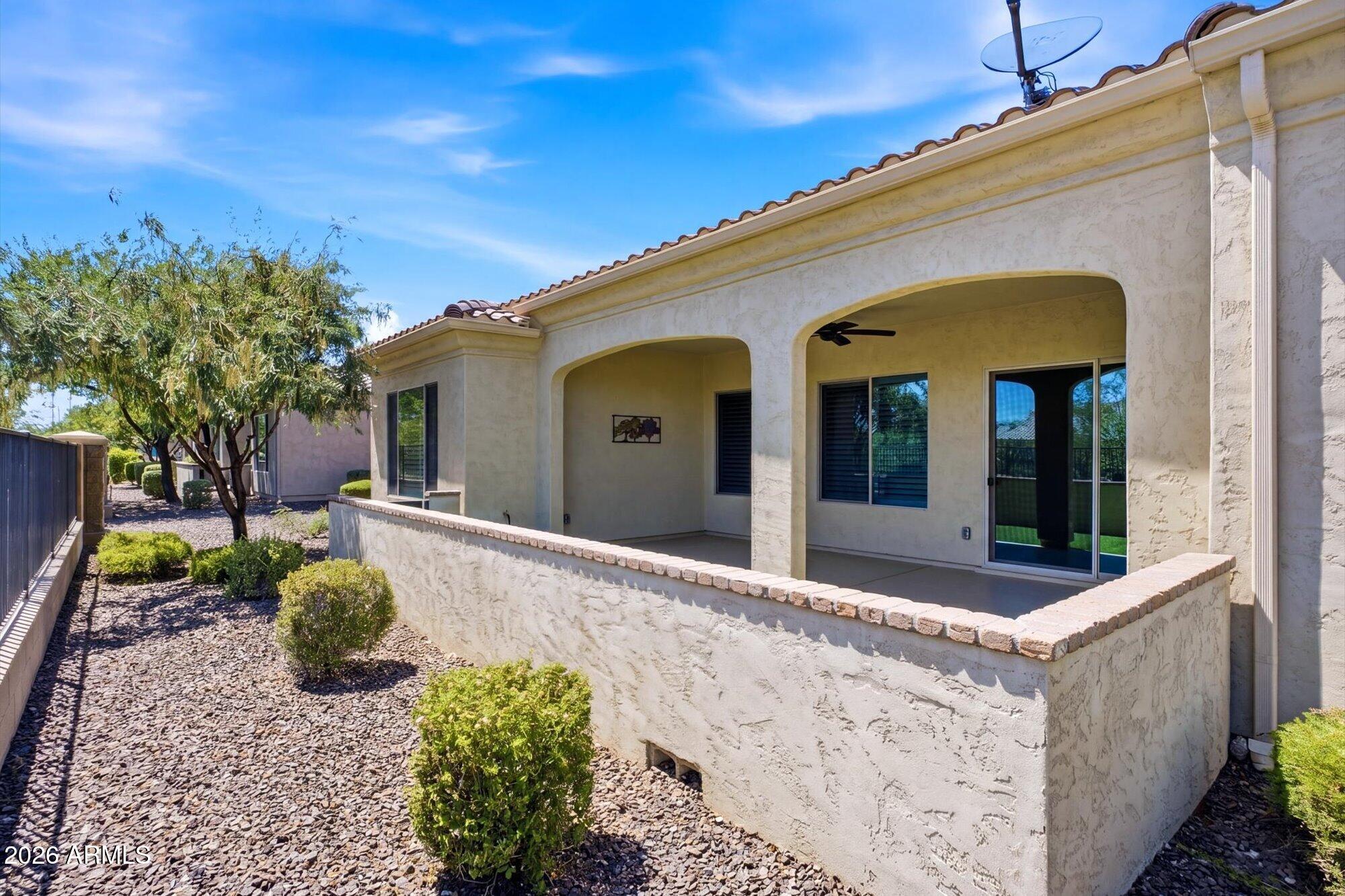 16849 West Merrell Street Goodyear, AZ 85395 - Photo 33 of 35 a front view of a house with garden