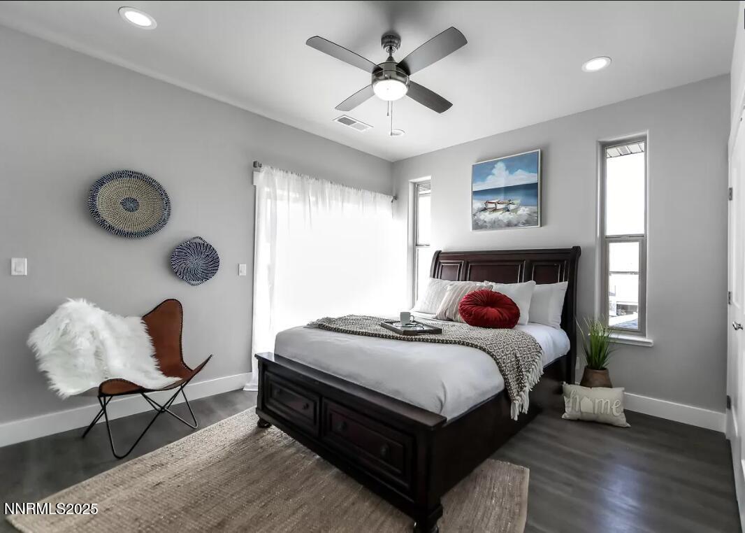 720 Bluffs Court, Unit 103 Reno, NV 89523 - Photo 5 of 7 a bedroom with a bed a window and a chandelier