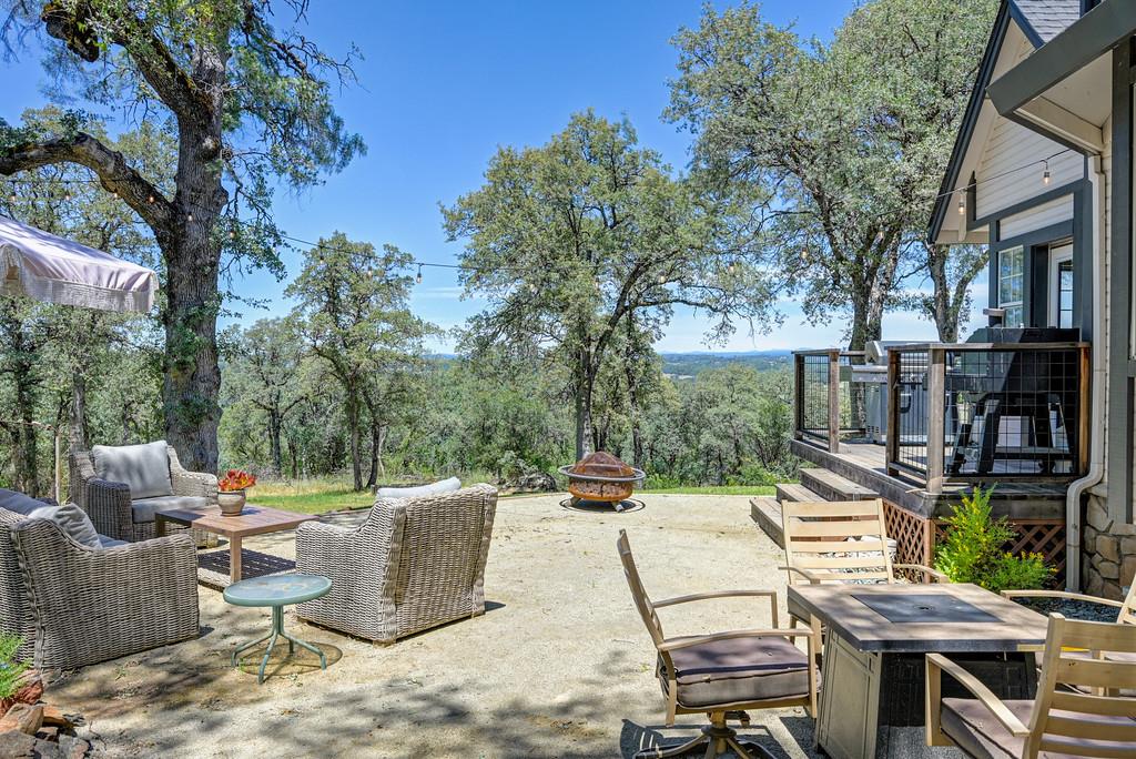3154 Twin K Road Pilot Hill, CA 95664 - Photo 72 of 89 a view of a patio with table and chairs and potted plants