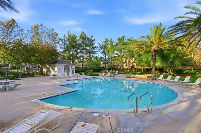 a view of a swimming pool with a patio