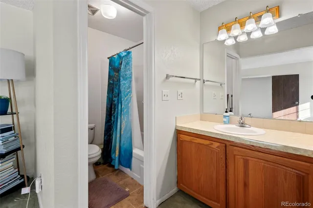 a en suite bathroom with a sink and a mirror
