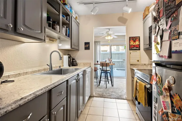 a kitchen with a sink and a stove top oven