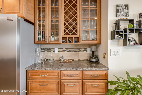 a kitchen with stainless steel appliances granite countertop a sink and a granite counter tops
