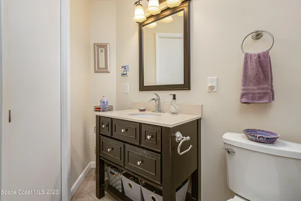 a bathroom with a sink vanity and a mirror