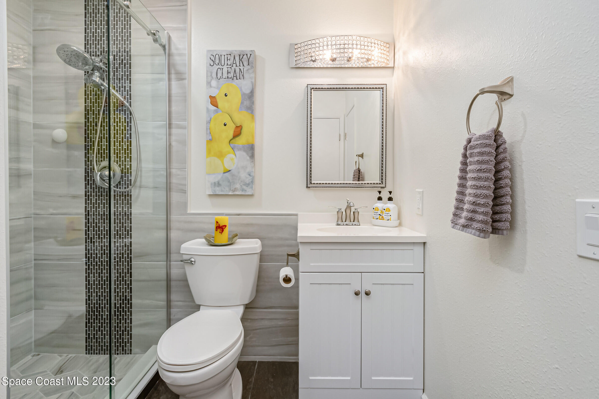 700 Wave Crest Avenue, Unit 202 Indialantic, FL 32903 - Photo 20 of 29 a bathroom with a sink a toilet and shower