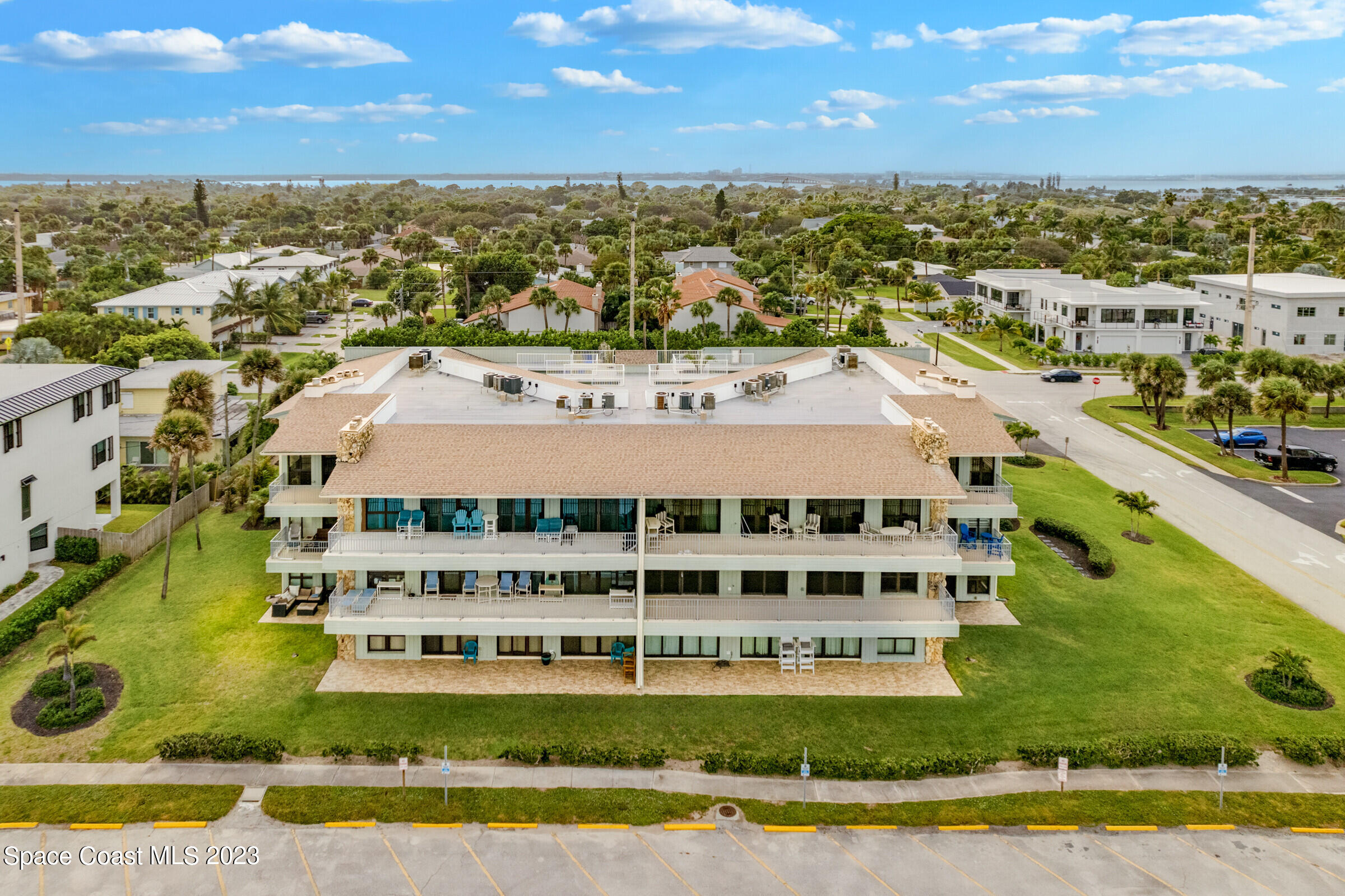 700 Wave Crest Avenue, Unit 202 Indialantic, FL 32903 - Photo 22 of 29 a view of a large building